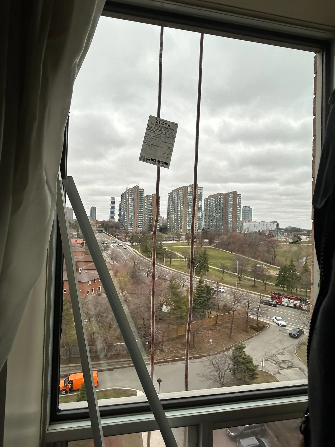High-rise window glass replacement in progress
