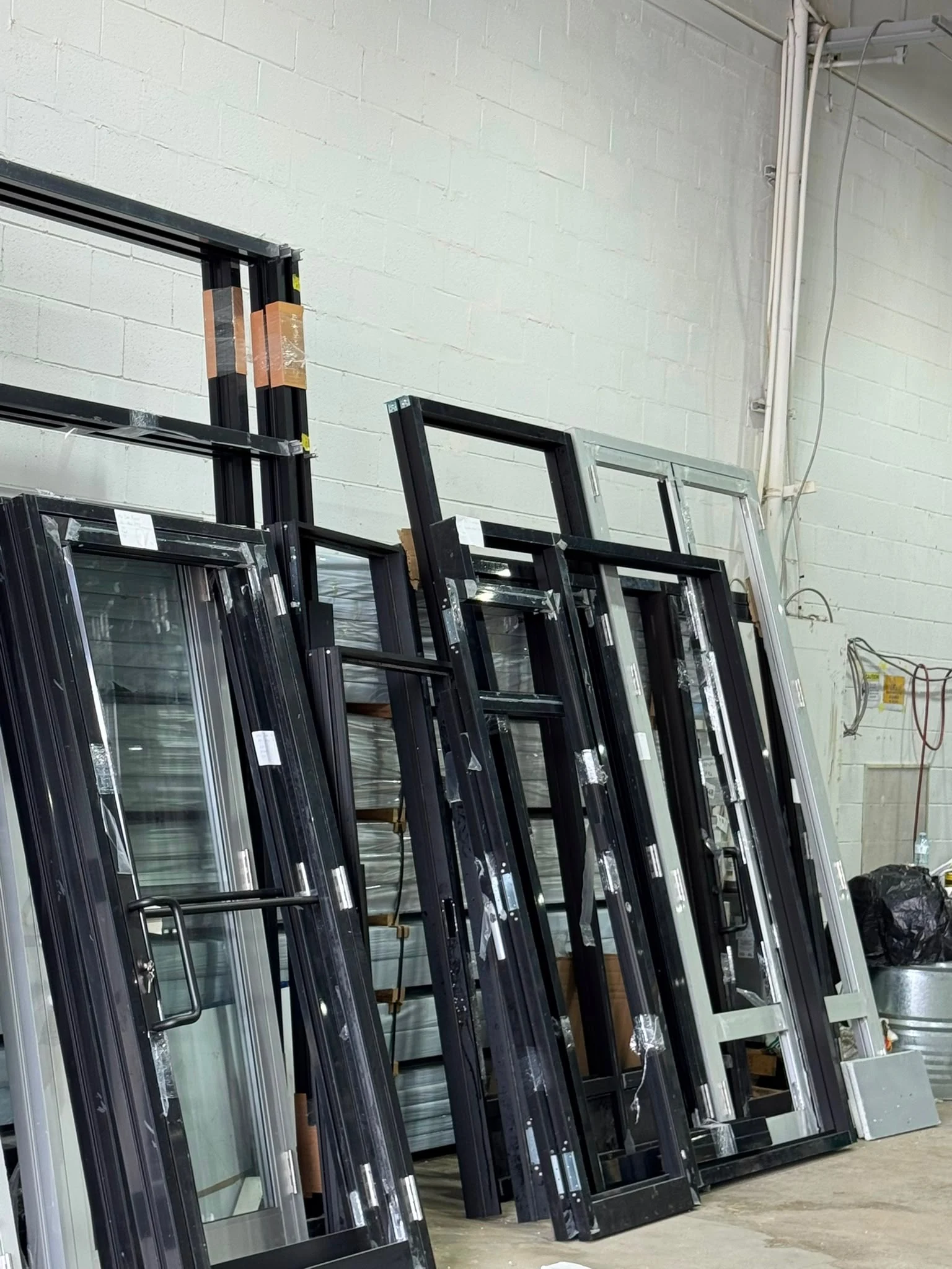 Commercial aluminum doors and frames prepared for installation by ALUWORLD LTD