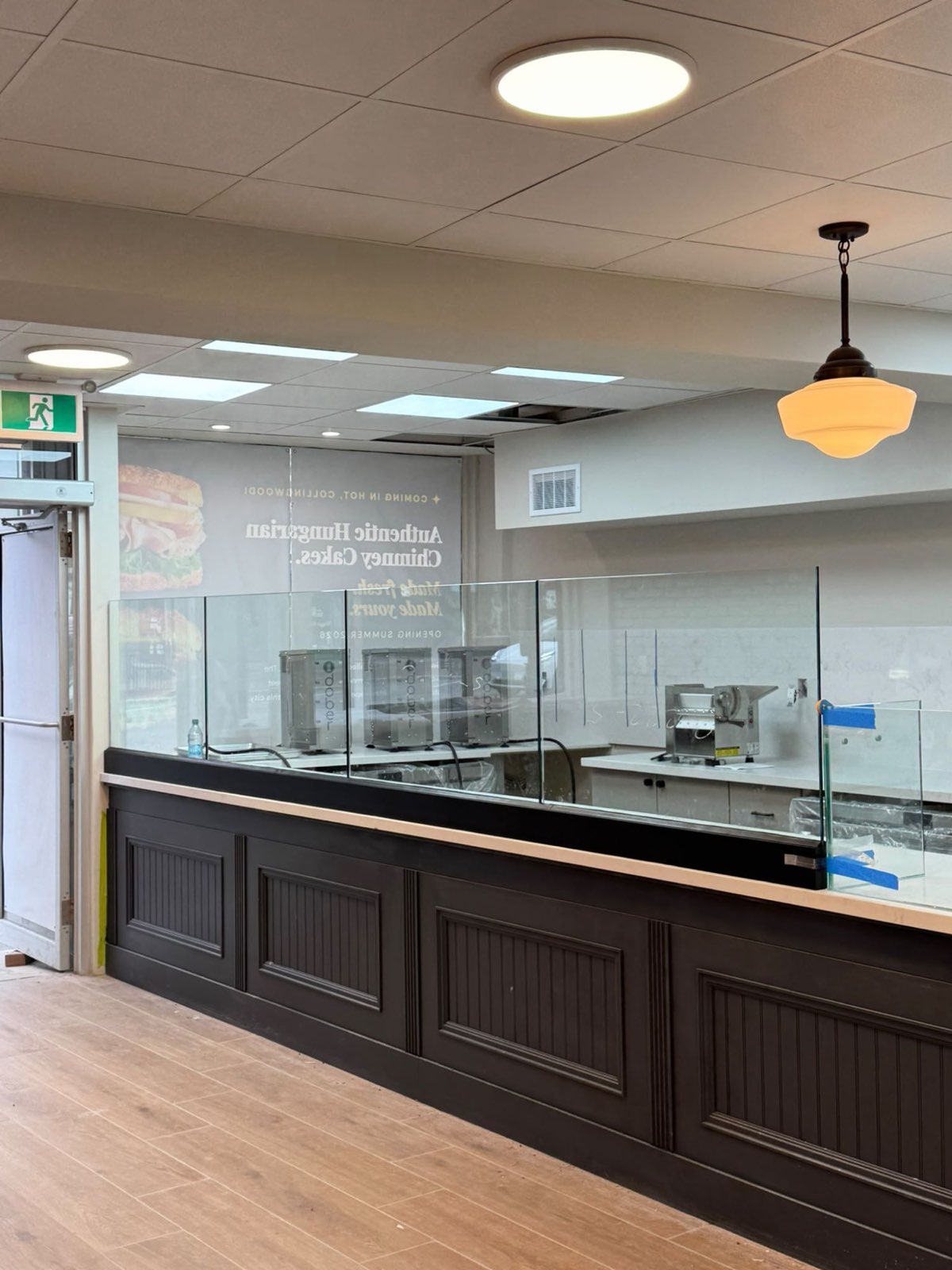 Clear glass guard along a bakery service counter